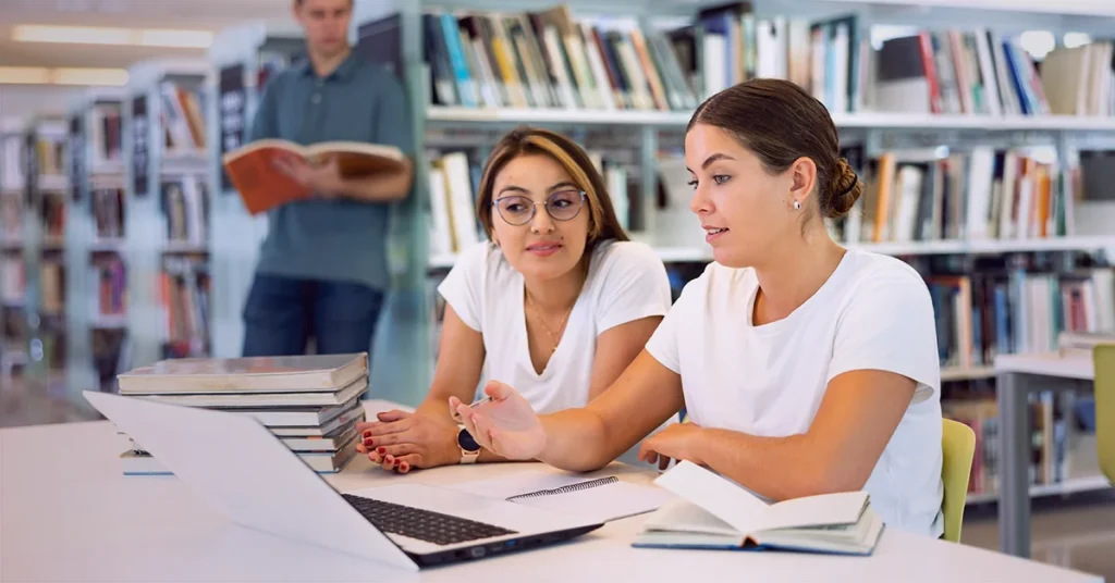 Finance graduates discussing on how to write CFA scholarship essay