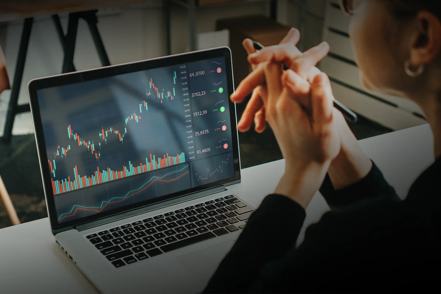 CMT charterholder evaluating market data via charts on a laptop