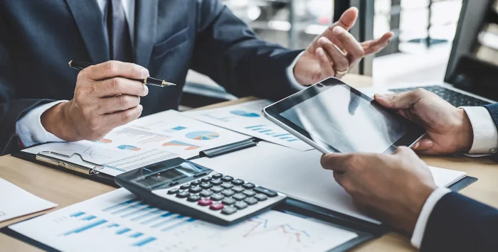 Finance professionals discussing which career path to choose from - CFA vs FRM