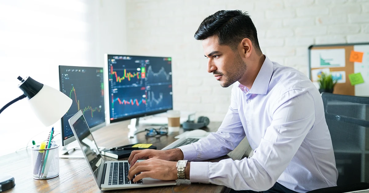 A CFA candidate analyzing charts and exploring the best CFA study materials for Levels 1, 2, and 3 for the exam.