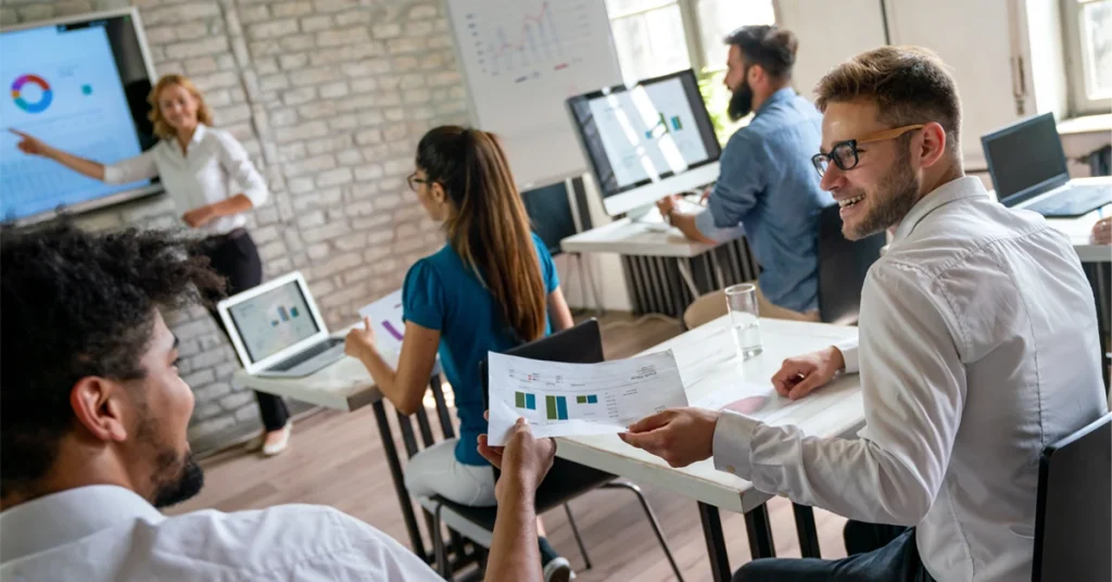 Group of professionals from non-finance backgrounds in a CFA prep classroom