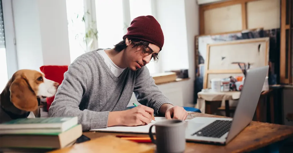CFA candidate registering online and taking notes to avoid common exam mistakes.