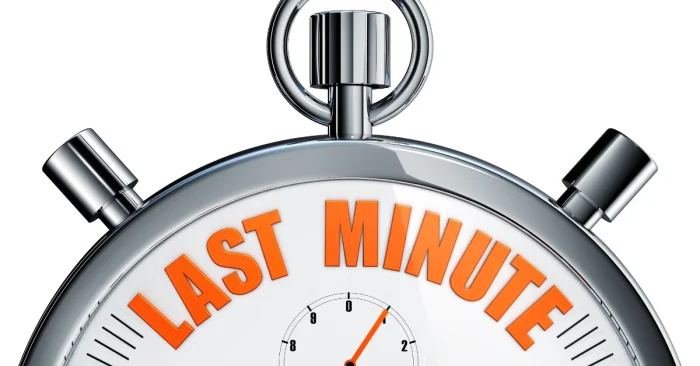 A stopwatch with 'LAST MINUTE' in bold orange letters, representing a CFA candidate's final countdown and urgency during last-minute exam preparation.