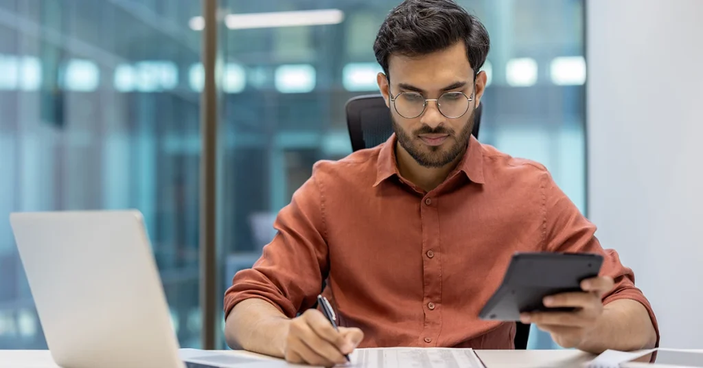 CFA candidate taking notes to avoid common exam mistakes during study prep