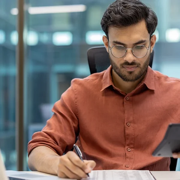 CFA candidate taking notes to avoid common exam mistakes during study prep