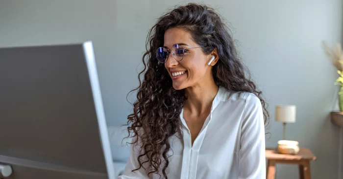 Professional reviewing data on screen showing value of CFA charter in India.