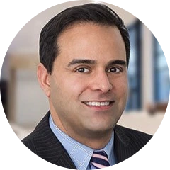 “Andrew Kerai, CFA, financial services executive and UWorld instructor sharing real-world asset management insights